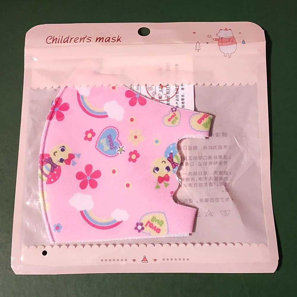 Children's re Usable face mask new in package never opened
